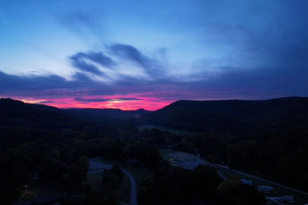 Aerial drone photograph of a Kansas City sunset captured by Reel Drone Rangers, highlighting professional aerial photography and videography services with a panoramic city view.