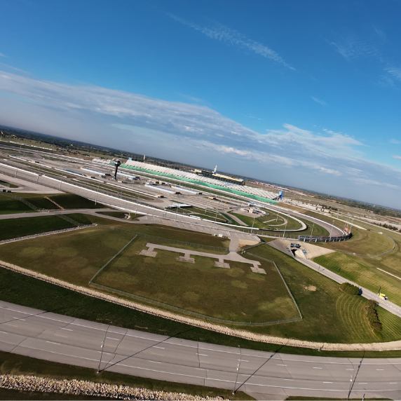 Aerial drone photograph of Kansas Speedway in Kansas City, captured by Reel Drone Rangers showcasing the full racetrack and surrounding area.